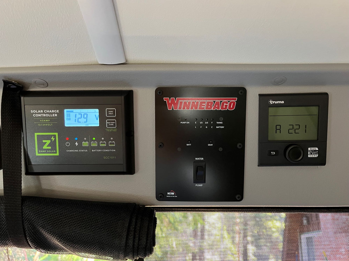 surrounded by tall trees and nature.|Bright white RV rental van — photo 10