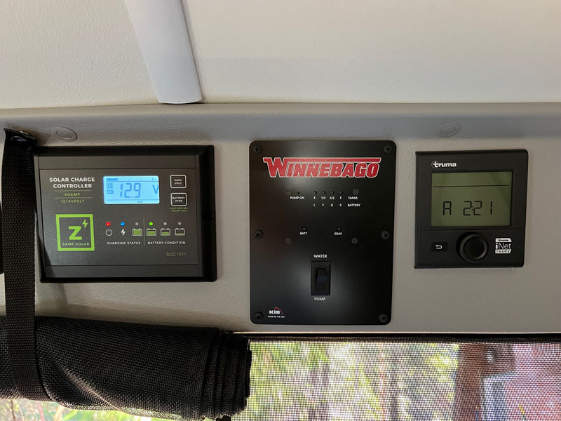  surrounded by tall trees and nature.|Bright white RV rental van — photo 10