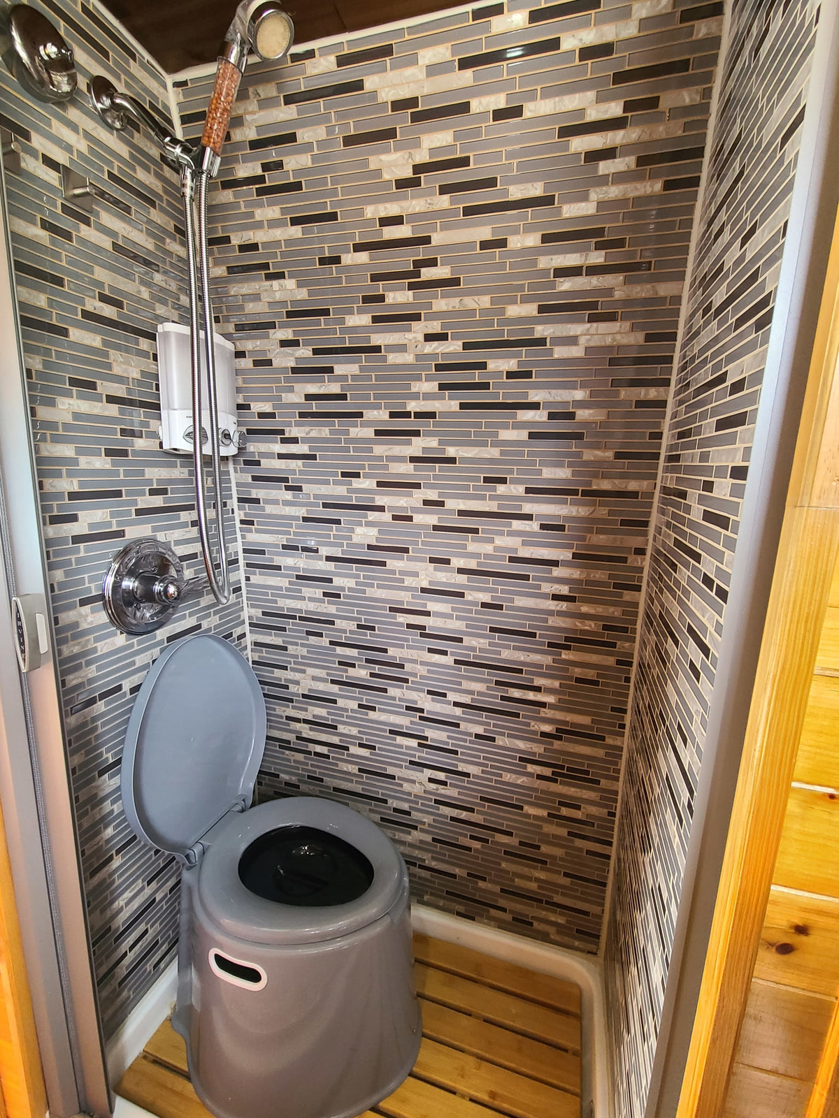  and open rear doors revealing a neighborhood street.|This RV rental's custom wood interior — photo 8