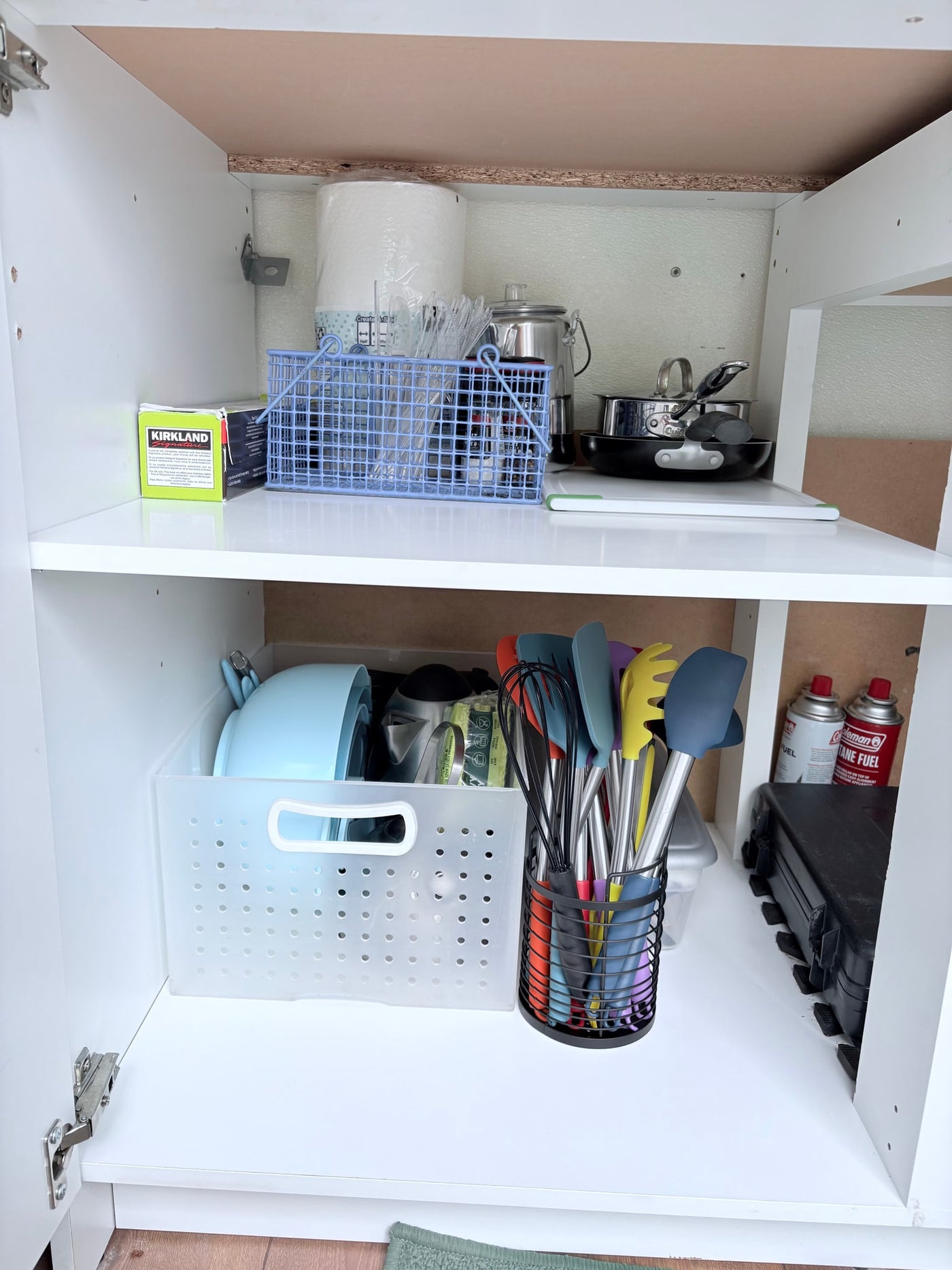 RV rental cabinet: Organized kitchenware, camping fuel, and utensils ready for your next adventure. — photo 9