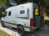 Winnebago Revel 4x4 camper van for rv rental, showing off-road features, roof rack, and rear storage.