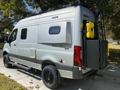 Winnebago Revel 4x4 camper van for rv rental, showing off-road features, roof rack, and rear storage.
