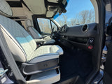 Step into this RV rental van's interior: luxurious quilted seating, modern dashboard, ready for comfortable journeys.