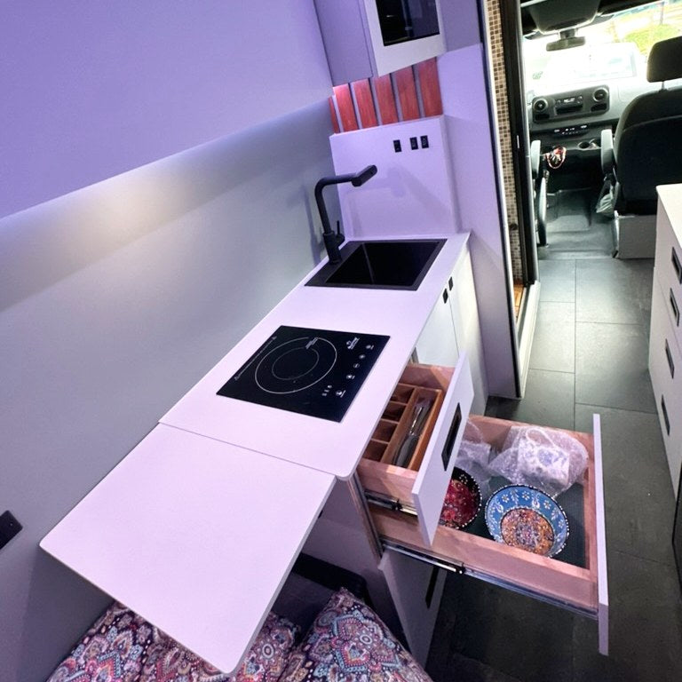  perfect for travel.|Cozy RV rental interior features a vibrant patterned bed — photo 2