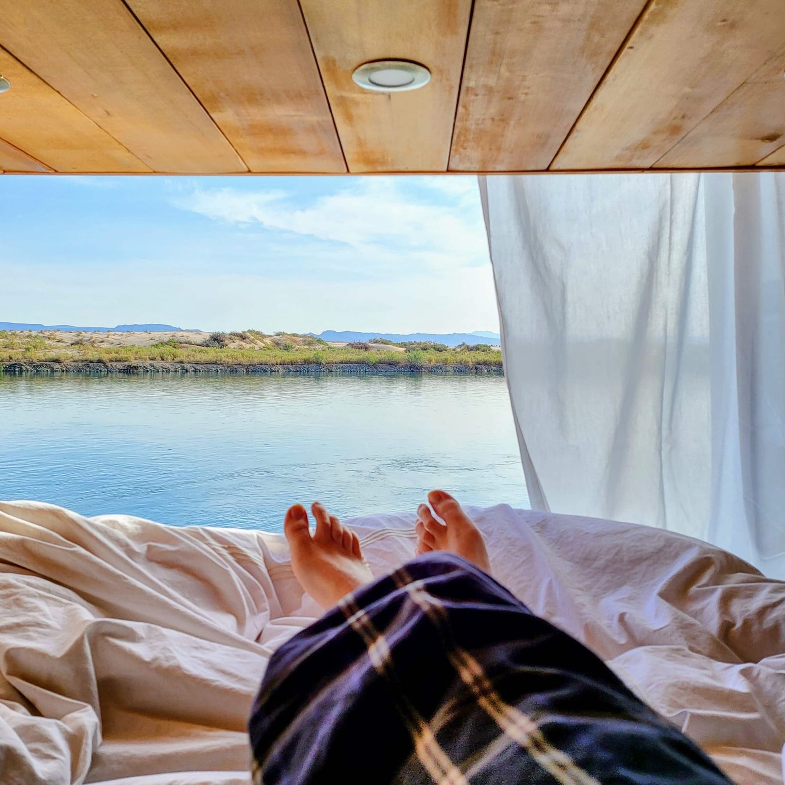 Wake up to serene water views from your comfortable RV rental, offering a relaxing nature escape.