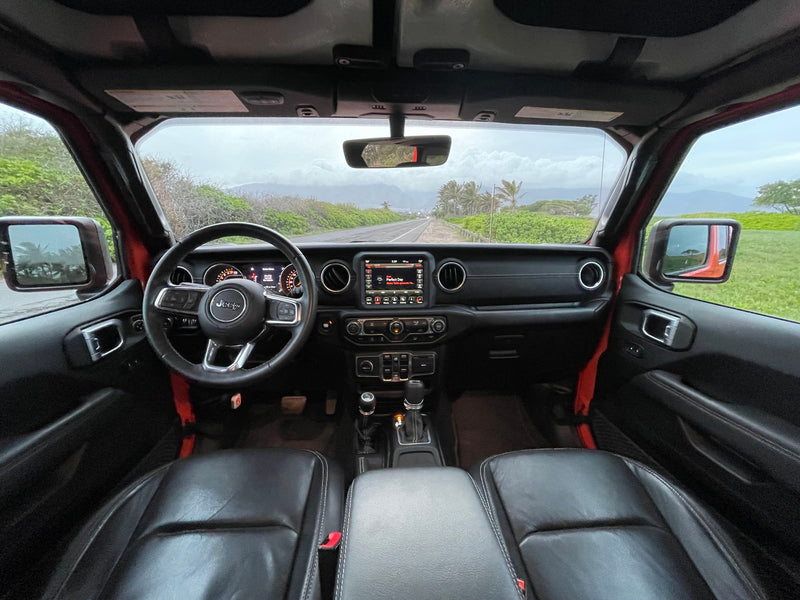 Jeep interior on a scenic road, an adventurous alternative to an RV rental. Dashboard, steering wheel, and tropical views. — photo 11