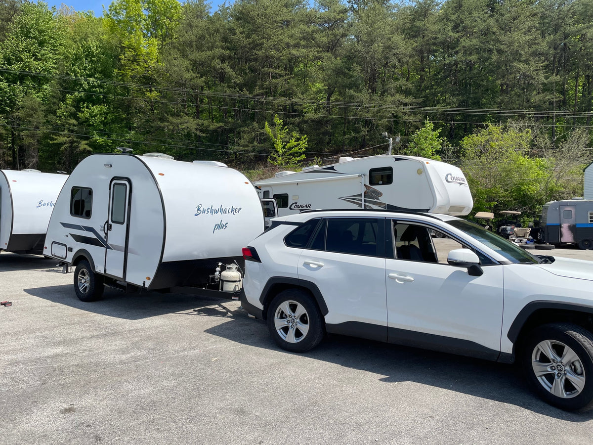  and window.|RV rental interior featuring a compact kitchen with microwave — photo 4