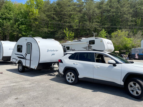  and window.|RV rental interior featuring a compact kitchen with microwave