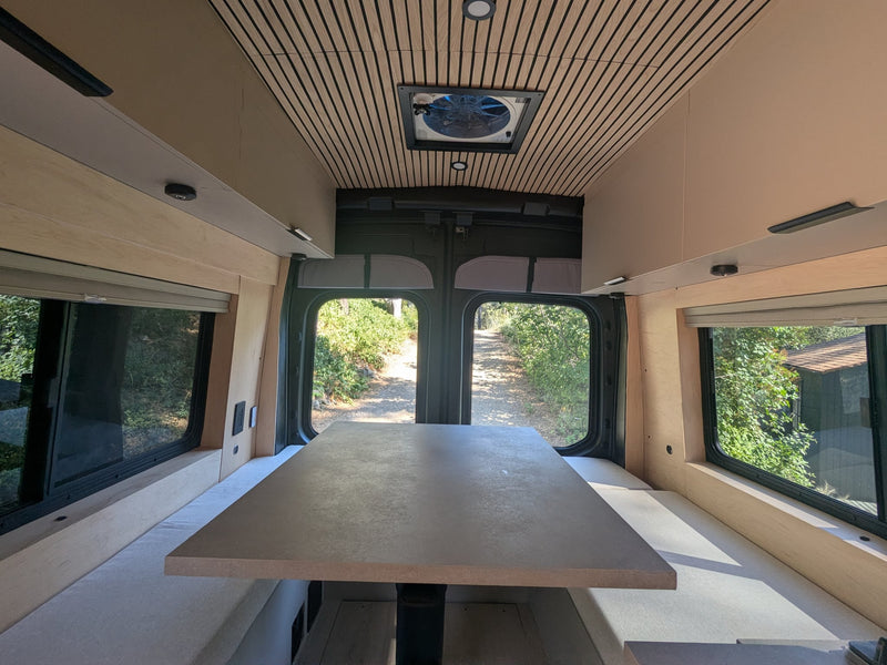  surrounded by nature.|Sleek rv rental interior showcasing a full kitchenette — photo 7