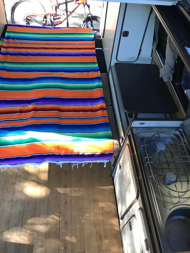  parked on a dirt road by the ocean. Perfect for an RV rental adventure.|Spacious RV rental interior — photo 11