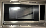  & a wooden breakfast tray with a bowl and camper mug.|An rv rental's compact interior showing a kitchen with stovetop & fridge