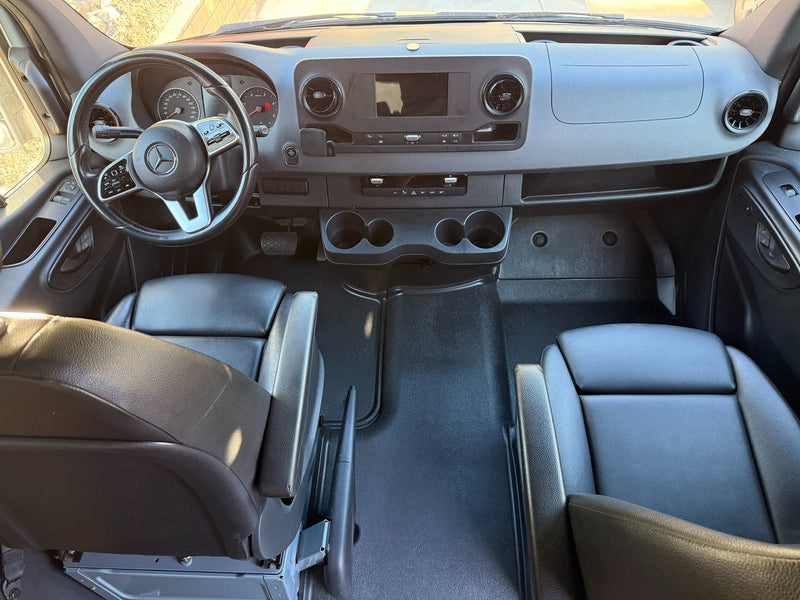  and black passenger seats. Ready for your next adventure.|Spacious RV rental interior with black captain's chairs — photo 5