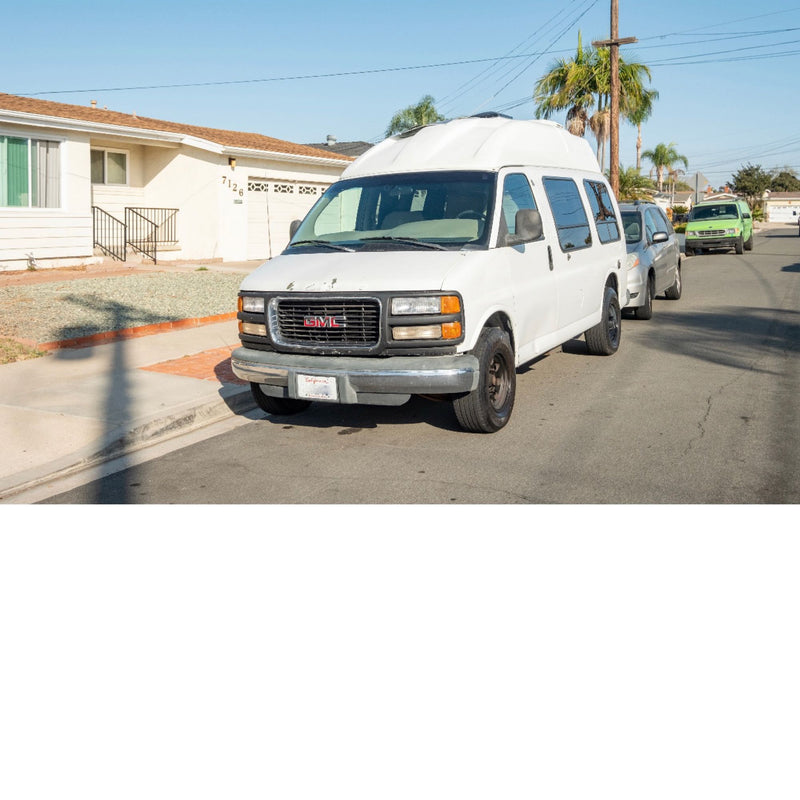  and a mounted TV.|Inside this rv rental: cozy living space with grey seating — photo 4