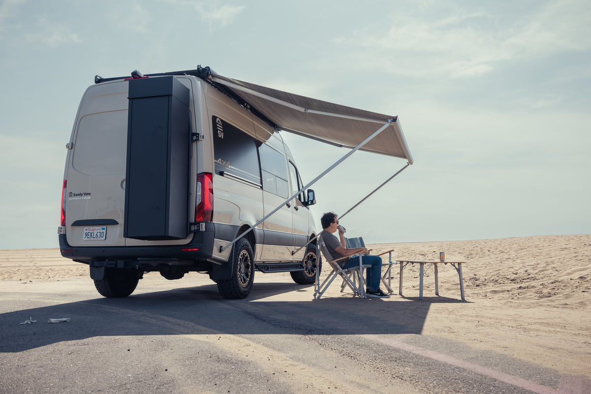  and ambient blue light accents.|Tan 4x4 Sprinter camper van — photo 6