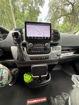 Dashboard view of an RV rental: Ram ProMaster interior with touchscreen navigation, gear shift, and climate control panel.