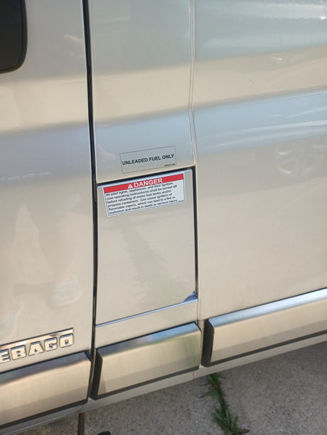 RV rental fuel area shows 'UNLEADED FUEL ONLY' and a DANGER warning about flammable vapors during refueling for safety.