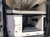 This RV rental shows a versatile interior with a raised bed, ample storage, and cargo space. Perfect for adventure!