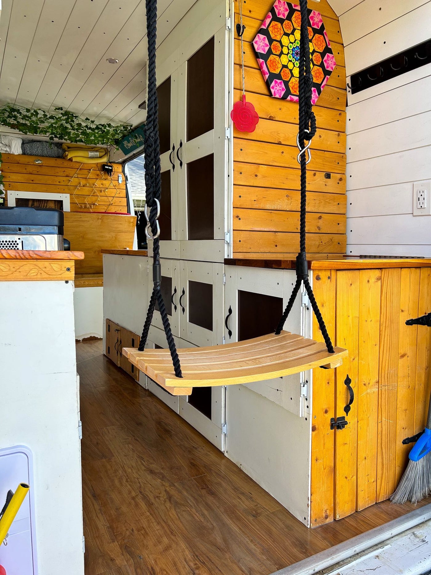  and red seating.|Inside a cozy RV rental: red cushioned seating/bed — photo 8