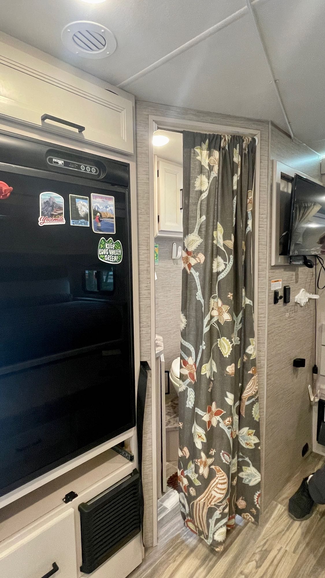  and power hookup.|Inside a modern RV rental: a spacious cockpit featuring beige seats — photo 9