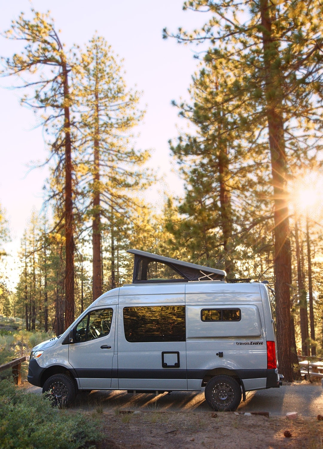 Grey camper van with pop-top in a sun-drenched forest. Ideal for your next rv rental outdoor escape. — photo 2