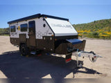 Robust DWELLER off-road travel trailer, perfect for RV rental adventures, parked outdoors on a sunny day.