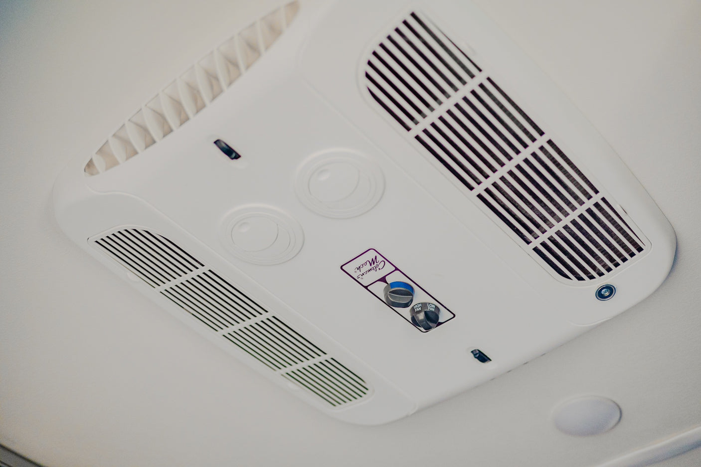 Overhead view of a white Coleman Mach RV air conditioner, essential for comfort in your RV rental.