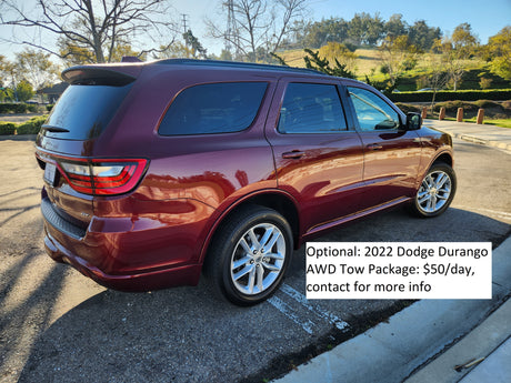 Red 2022 Dodge Durango SUV rental with optional AWD Tow Package ($50/day), perfect for your RV rental trip.