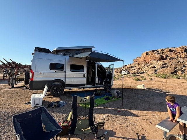  and a ceiling vent.|View into an RV rental from the open rear — photo 7