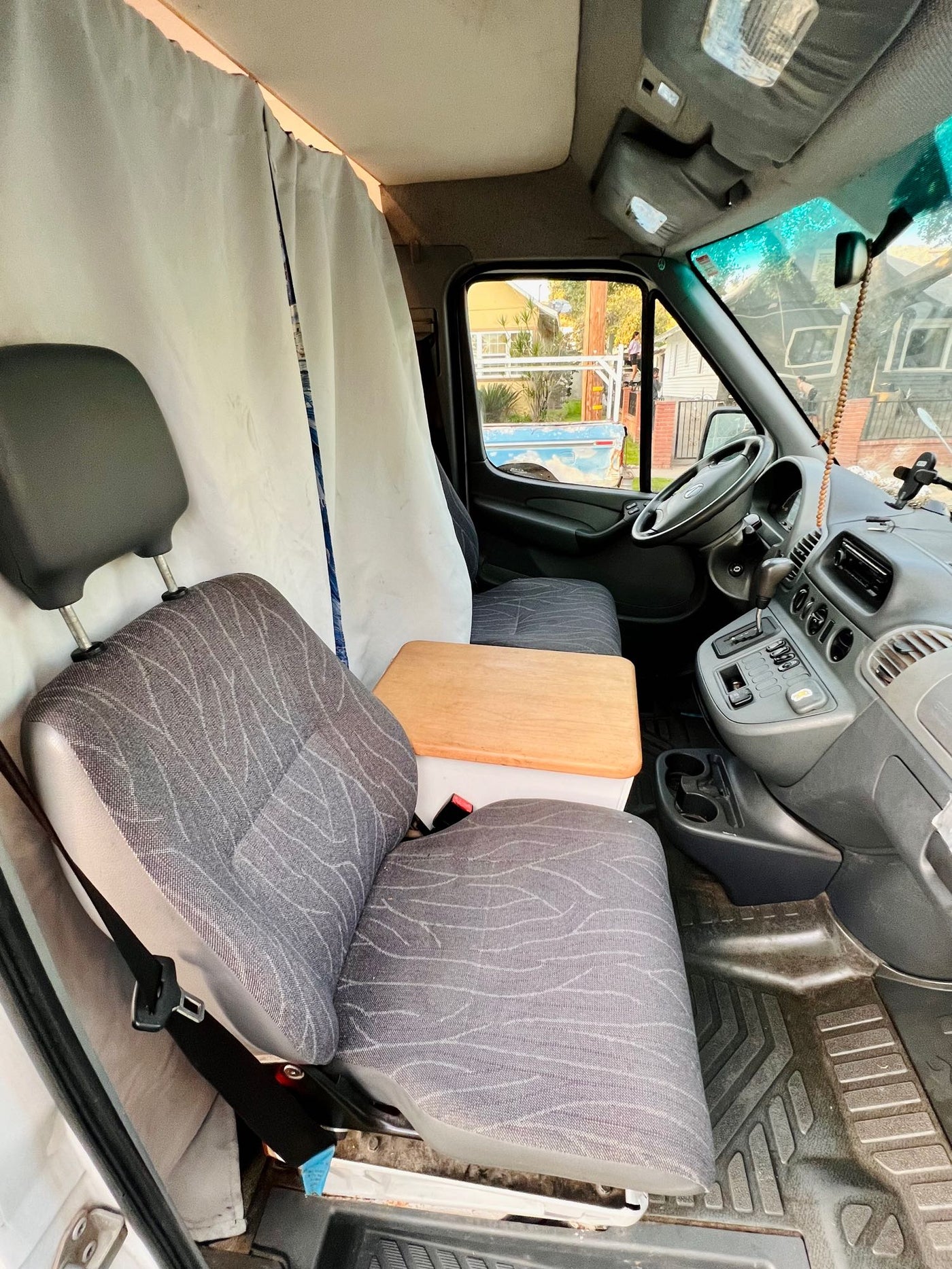  and unique Starry Night divider create a mobile home.|Inside an rv rental: a compact kitchen area with a wooden countertop — photo 18