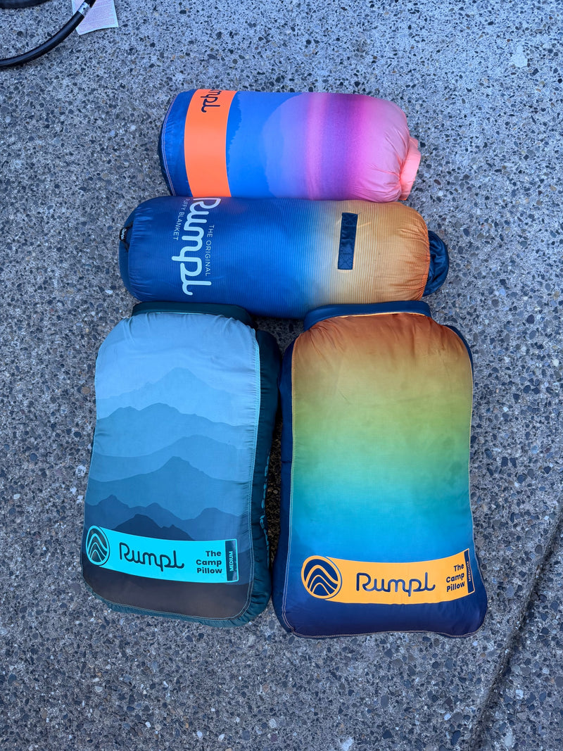 Colorful Rumpl puffy blankets and pillows, ideal for your RV rental. Perfect outdoor comfort for any adventure. — photo 12