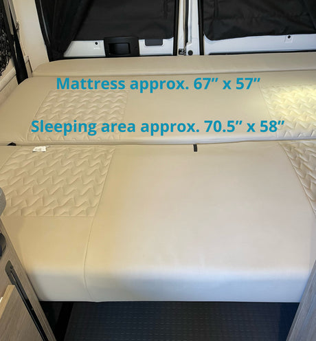 RV rental interior bed with mattress (67"x57") & sleeping area (70.5"x58") dimensions, showing convertible comfort.