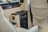 Luxury RV rental: Fusion audio system (FM 104.70 MHz), USB charging, and cup holders within the cream leather interior.