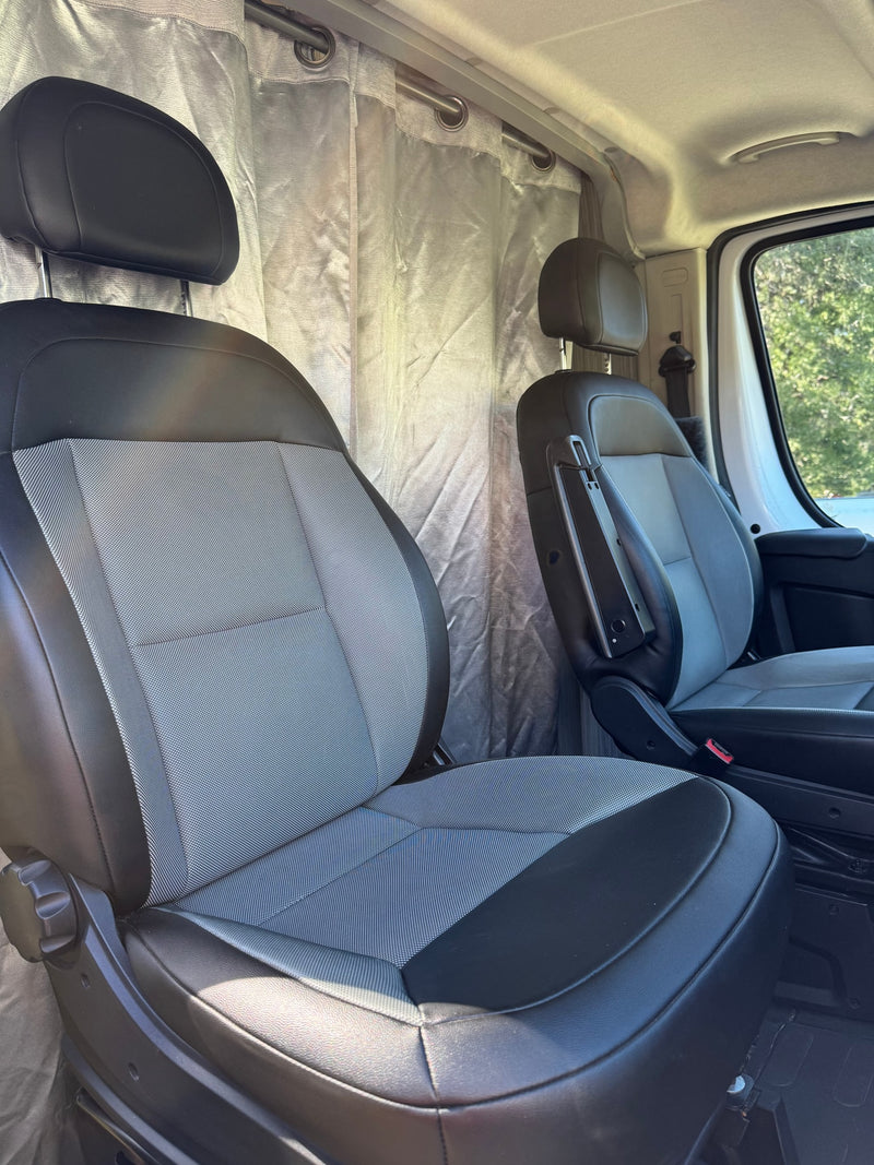  and comfy seating inside a modern camper van.|RV rental: Modern kitchen with sleek gray cabinets — photo 13