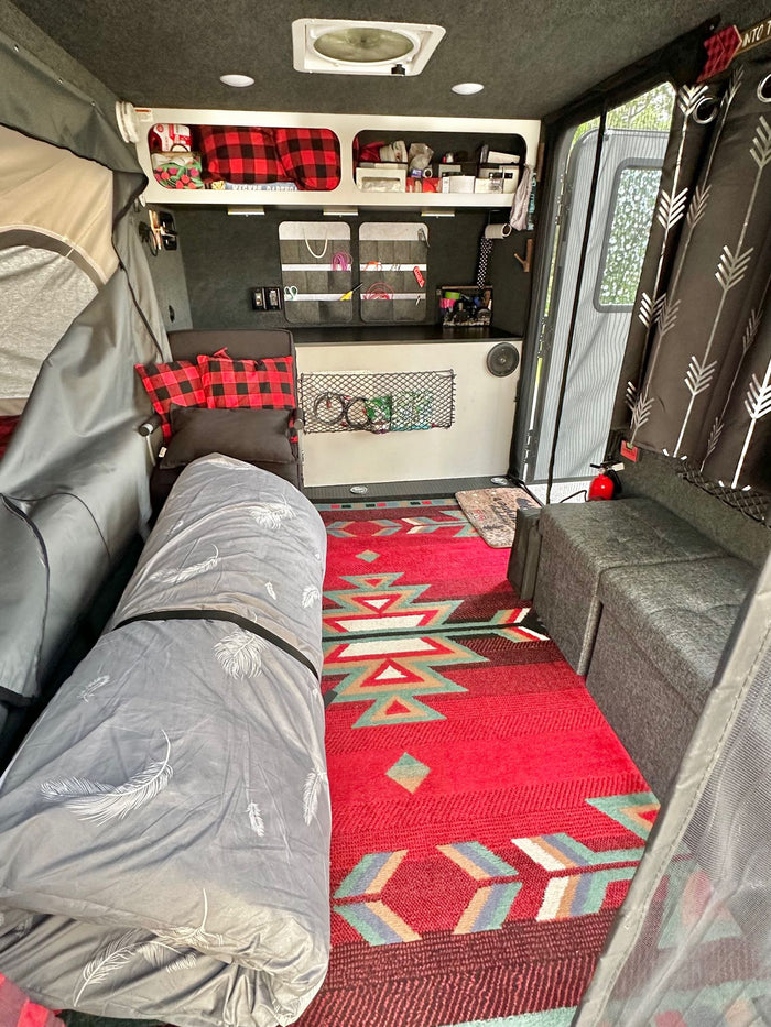  parked in a driveway. The door is open