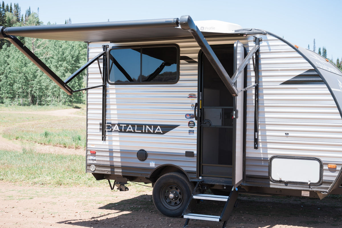 This Catalina rv rental features an extended awning and open door, ideal for your outdoor adventure. — photo 3