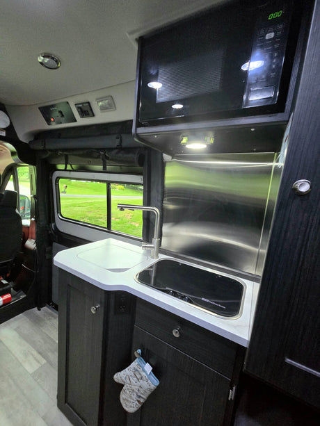  equipped with an extended side awning and rear-mounted spare tire