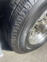 Close-up of a robust tire on an rv rental vehicle, showing deep tread and sidewall. Essential for safe travel and maintenance.