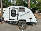 This white Braxton Creek Bushwhacker teardrop RV rental is ready for your next camping adventure.