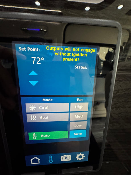 An RV rental's digital climate control screen, set to 72°, shows cool mode options and a warning about ignition.
