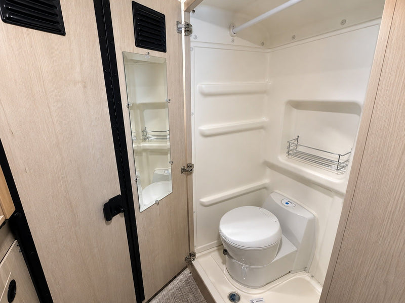  and windows with scenic views.|Comfortable RV rental interior with a mobile office setup — photo 12