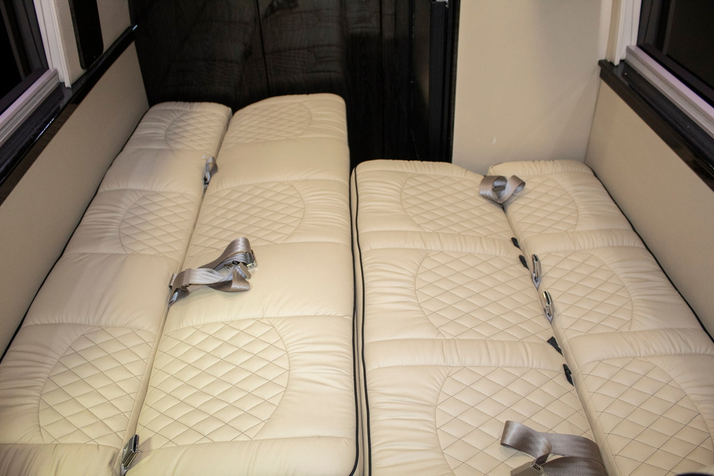  perfect for travel.|Luxury RV rental interior: Cream leather captain's chairs — photo 2
