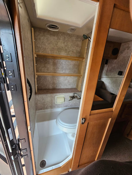 and an overhead sleeping bunk for comfortable travel.|An open