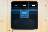 Black Dometic RV air conditioner unit with display panel and vents, mounted on wood, perfect for your rv rental comfort.