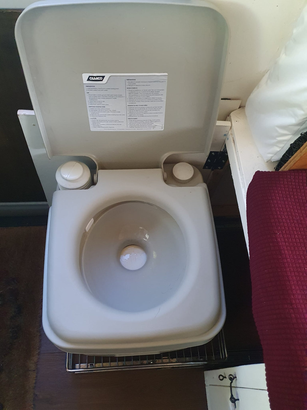  and storage baskets for comfortable viewing.|Cozy RV rental interior with wooden ceiling — photo 10