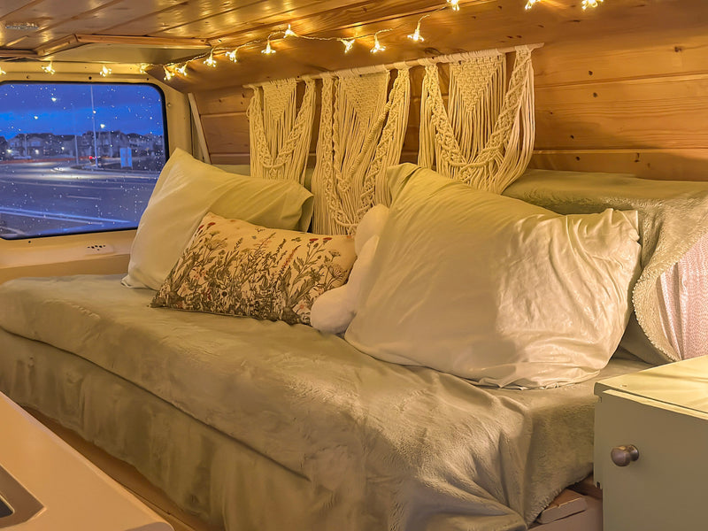  and charming flower string lights for your adventure.|Cozy RV rental interior with flower string lights — photo 16