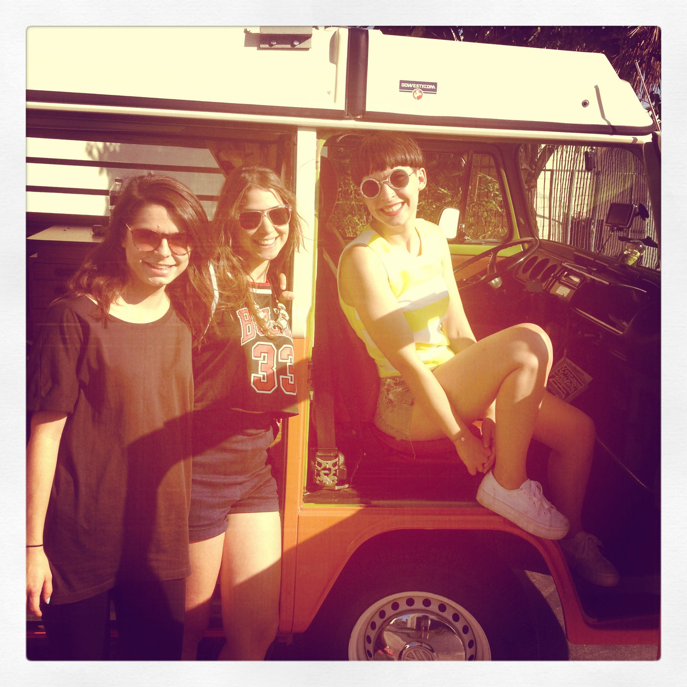 Three friends with a GoWesty campervan RV rental. Perfect for a sunny road trip adventure!