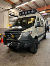 Customized off-road Sprinter camper van, ready for adventure. Ideal rv rental for rugged journeys.