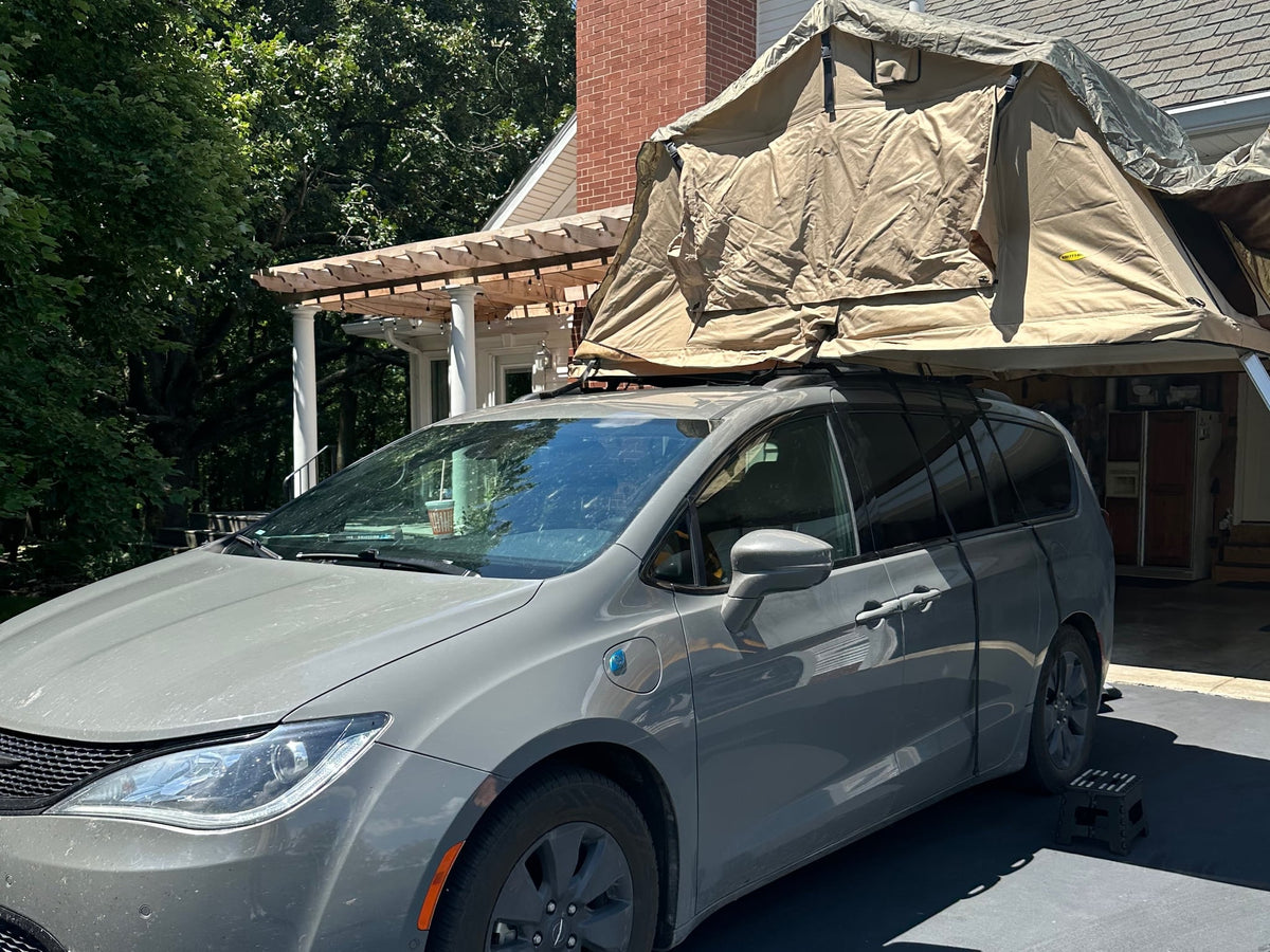 perfect as an RV rental alternative.|Dusty grey Chrysler Pacifica minivan with a Smittybilt rooftop tent — photo 2