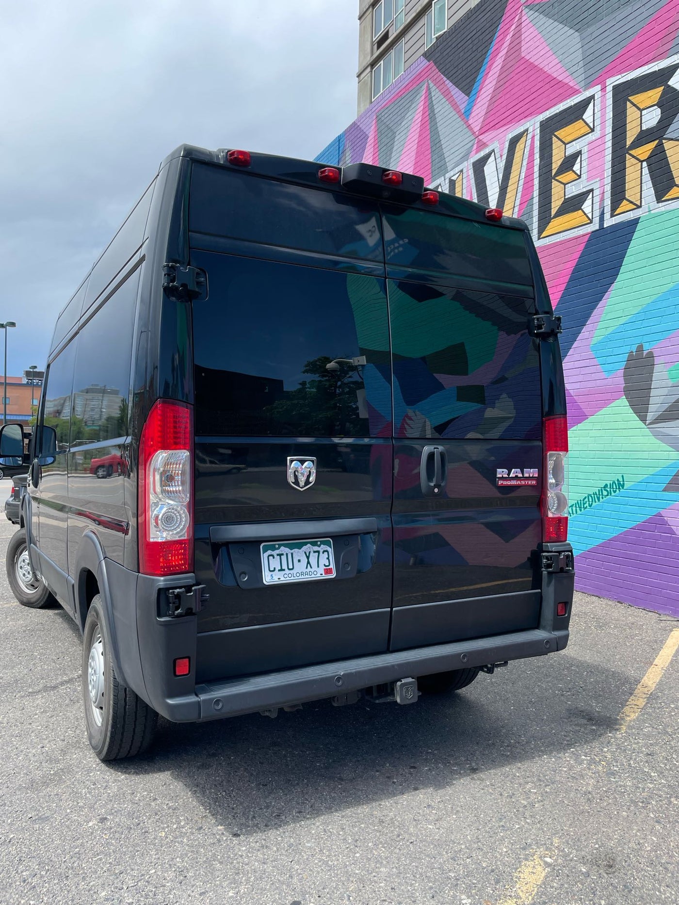  parked by a vibrant mural in Denver — photo 6