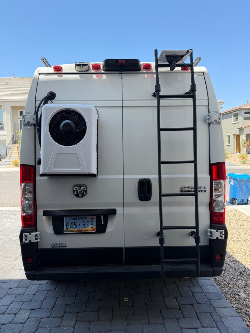 Customized white Ram ProMaster van rv rental with exterior AC unit, roof access ladder, and satellite internet. — photo 4